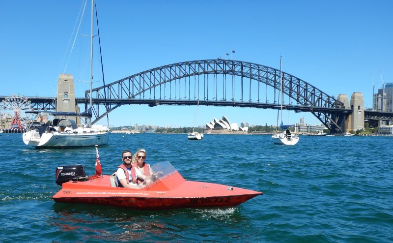 A small red boat on Lavender Bay