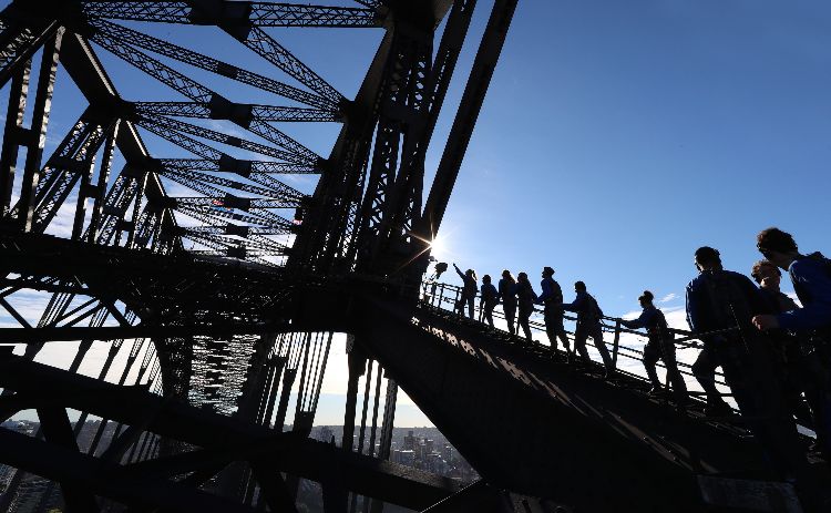 People walking up stairs on the insider climb on the Sydney Harbour Bridge 