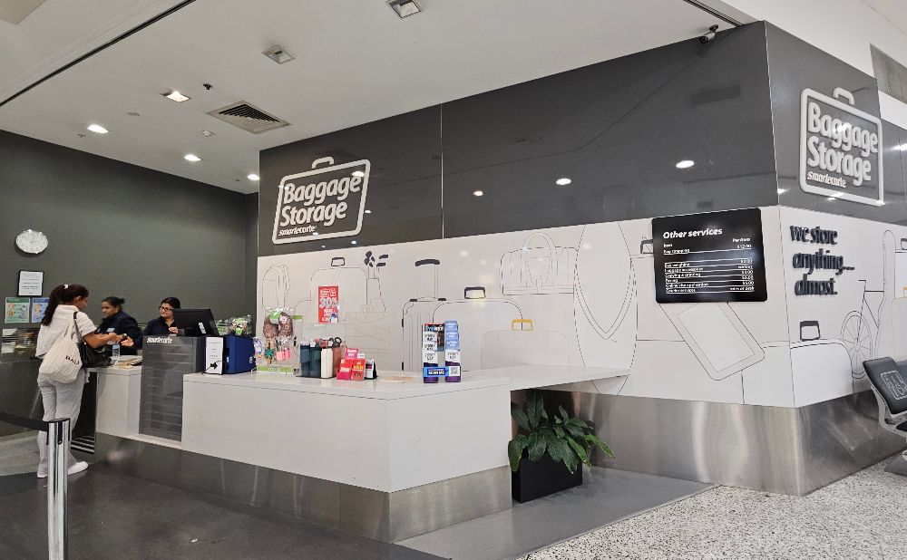 Luggage storage is just past the Meeting Point at the opposite end from McDonalds.