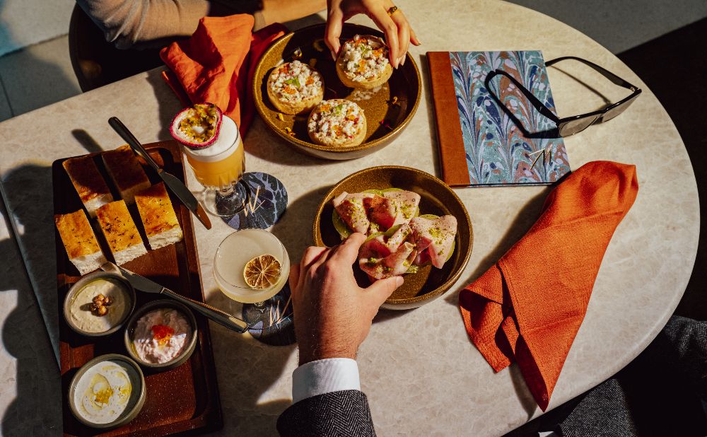 a table of snacks offered at Cruise Bar Circular Quay