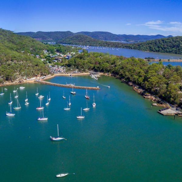 Aerial views of Brooklyn on the Hawkesbury River and its estuarine waterways and bays have many luxury yachts moored in its waters.