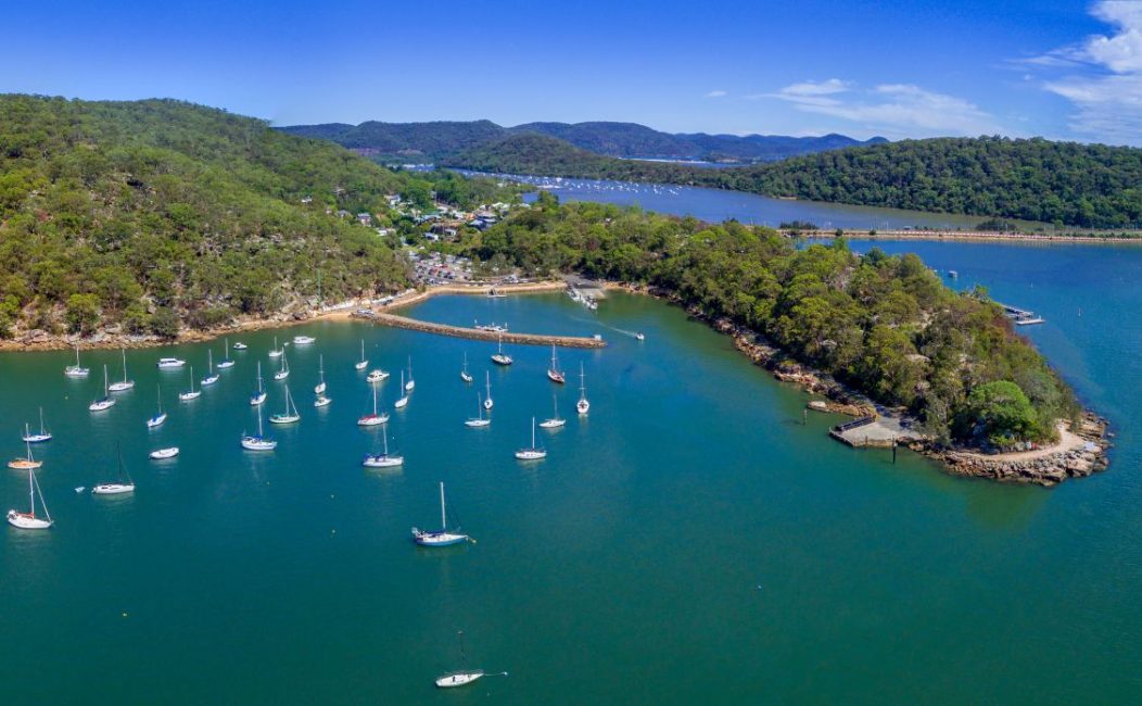 Aerial views of Brooklyn on the Hawkesbury River and its estuarine waterways and bays have many luxury yachts moored in its waters.