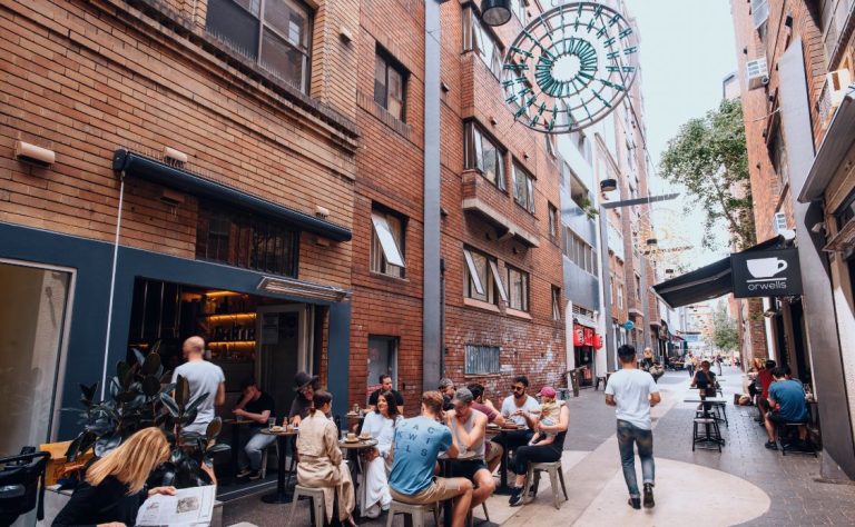 Patrons enjoying breakfast at laneway cafe Room 10 in Potts Point. Credit: Tourism NSW