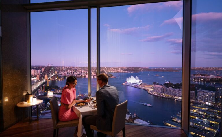 couple dining with a view of Opera House and Sydney harbour Bridge