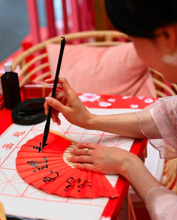 Red fan with chinese calligraphy for Lunar New Year 