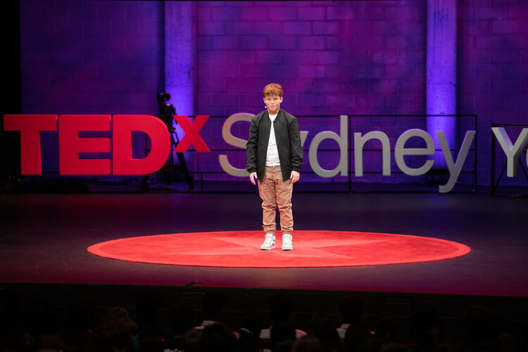 Young boy on stage at TEDx Sydney