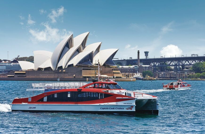 captain cook hop on hop off ferry in front of the Sydney opera house