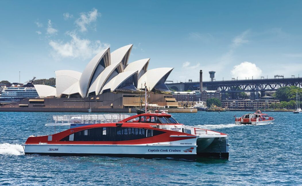 captain cook hop on hop off ferry in front of the Sydney opera house