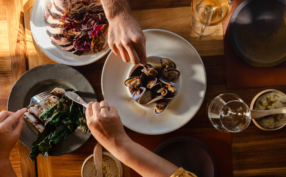a table of food highlighting the produce of the Tweed Region to promote Savor the Tweed