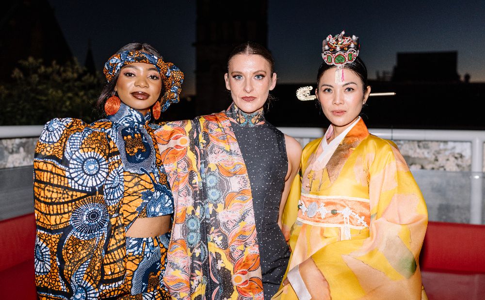 3 women from different cultural backgrounds in cultural dress