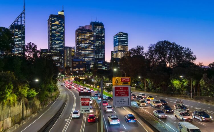 Cahill Expressway with cars in traffic during peak hour at dusk.