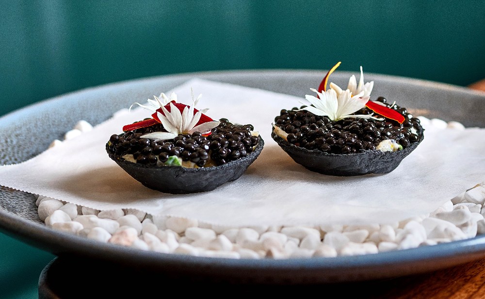 Nelly's prawn tart with caviar in charcoal tartlet credit: David Griffen