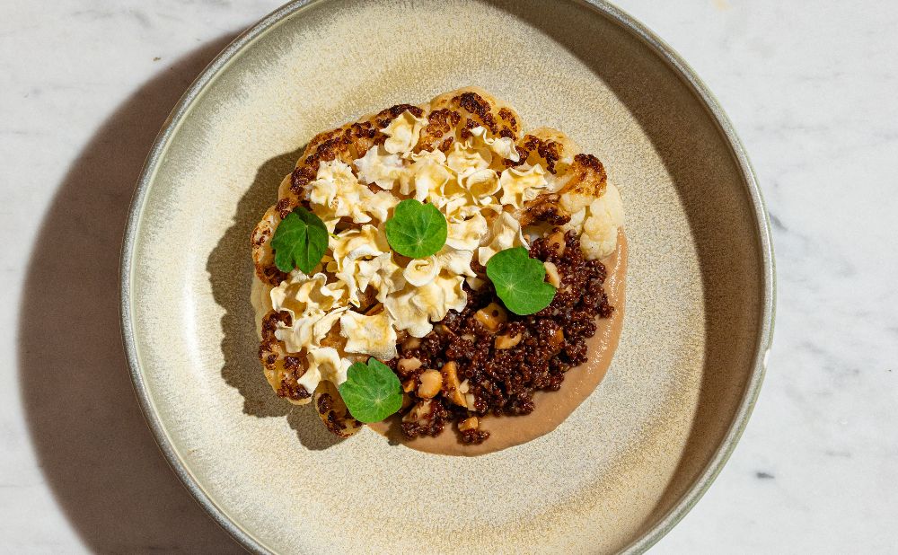 Pot Roasted Cauliflower with quinoa, macadamia and parsnip crisps