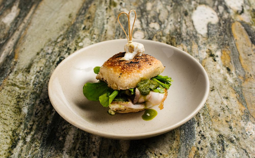 Grilled porchetta roll, stracciatella, salmoriglio, rocket
