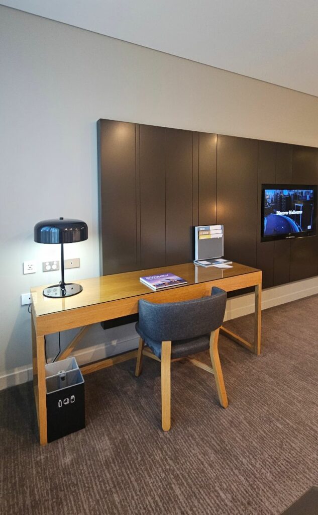 Large desk with chair and plenty of power outlets