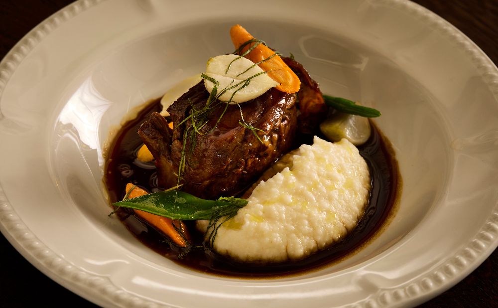 Saffron braised lamb shoulder served on polenta