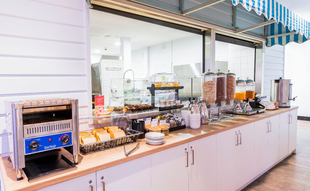 continental breakfast with bread, cereal and pastied