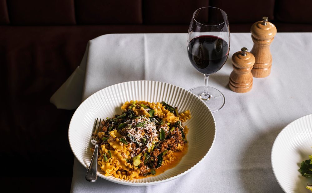 Bistro George - Mafaldine, pork and fennel sausage ragu with a glass of red wine.