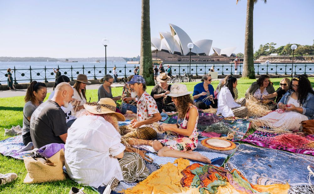 Weaving Workshop at Dawes Point with a group of men and women learning Aboriginal weaving 
