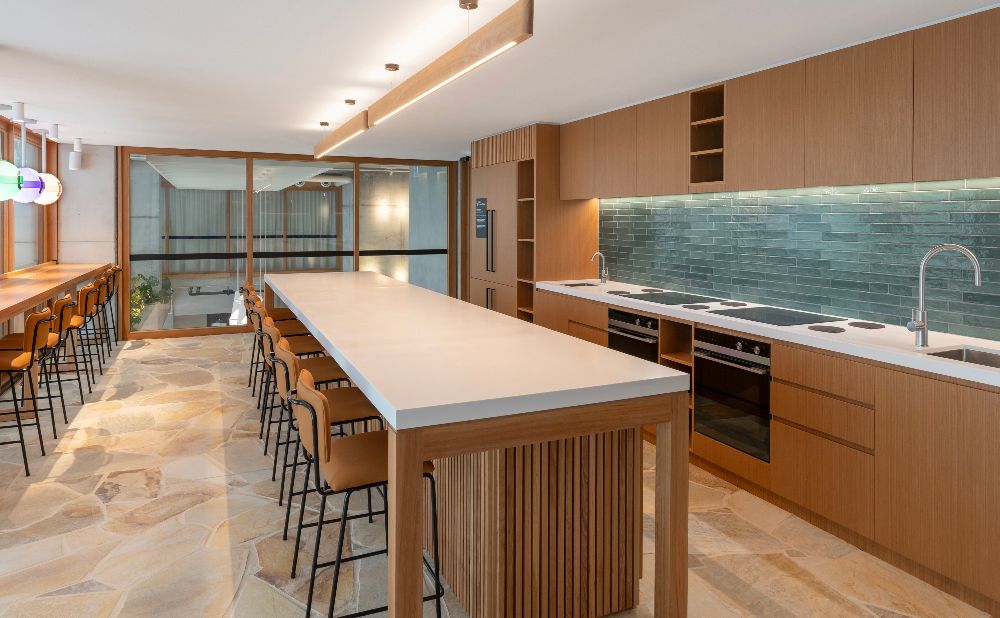 large open kitchen space with benchtop and double oven