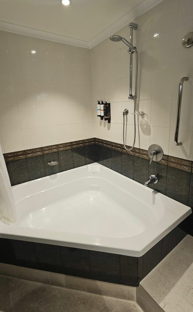 A large corner bath featured in our deluxe room