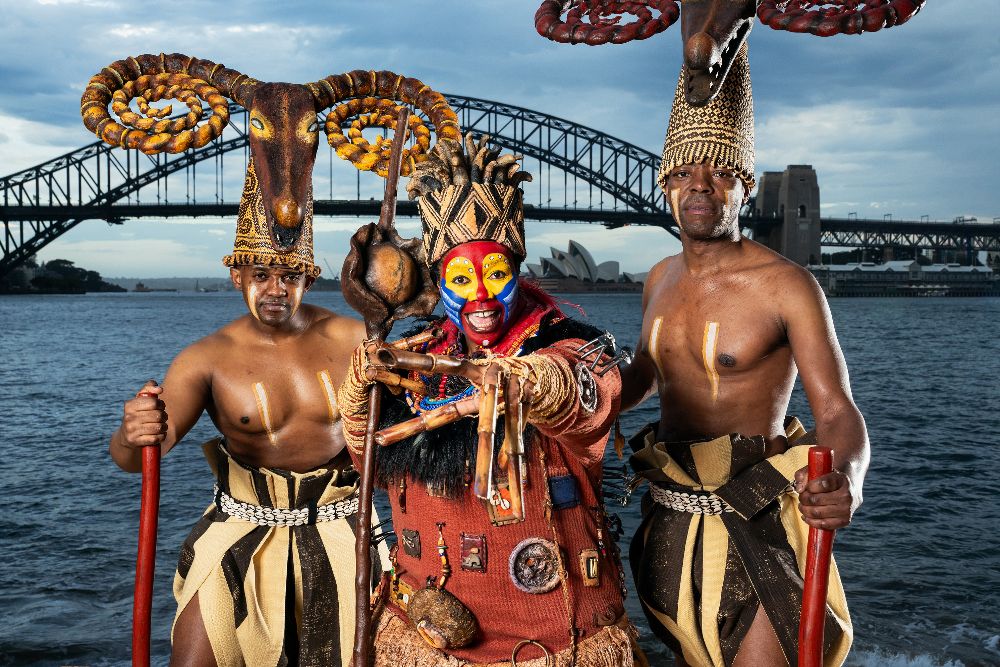 Lion King cast in front of Sydney Harbour