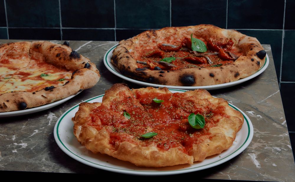 3 pizzas with tomato and cheese