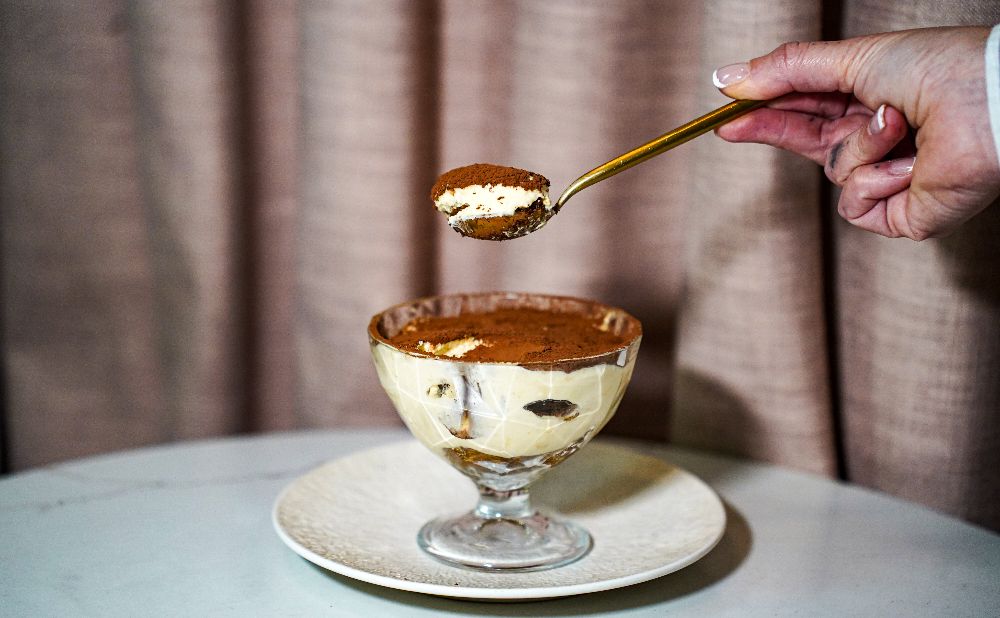 A silver bowl of tiramisu
