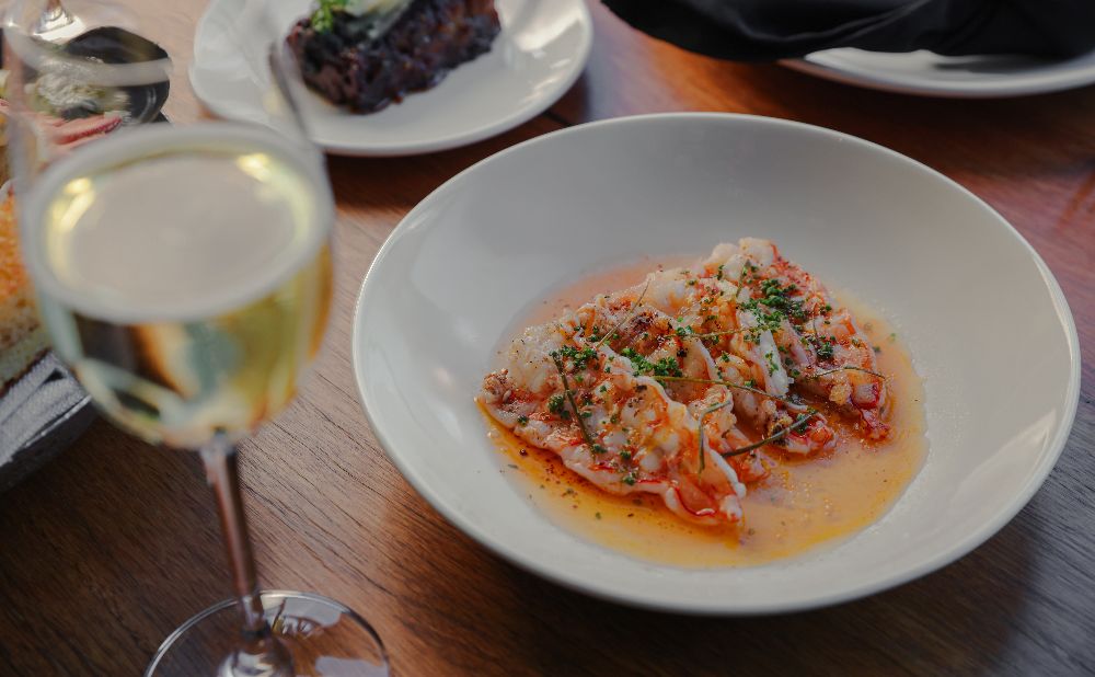 Plate of prawns with a glass of white wine