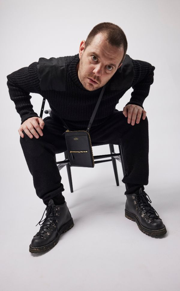 Mike Skinner sitting on a chair looking into the camera