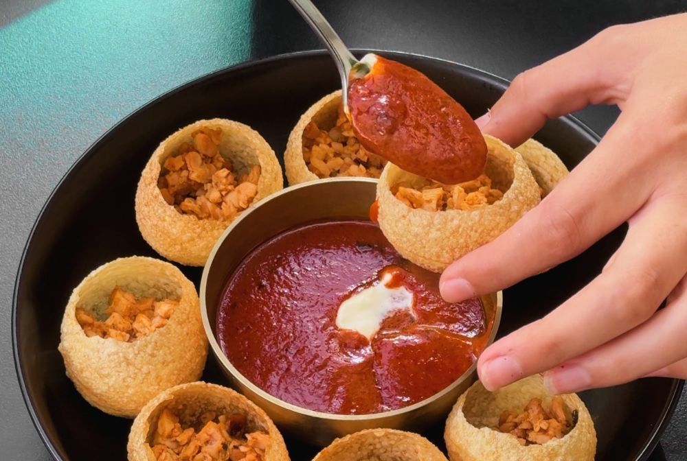 Panipuri, known specifically as "Curry Bombs" at Masala Theory.