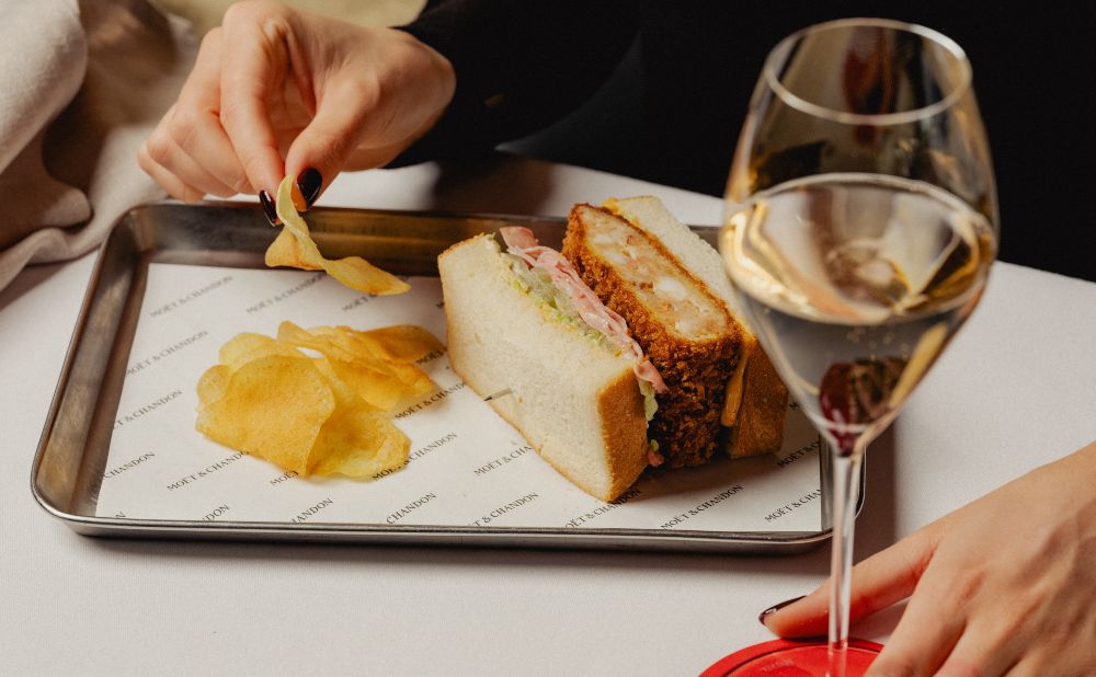 Champagne Club lobster, LP's mortadella, pickled green tomato, lettuce and spicy mayonnaise and housemade crisps with a glass of Moët & Chandon Brut
