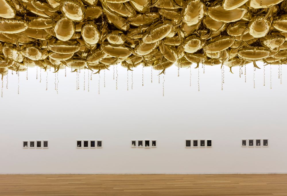 gold balloons on a ceiling. Speech Bubbles by Phillippe Parreno