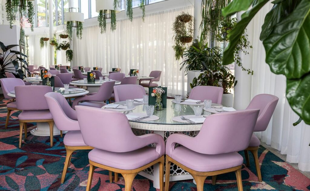 Botanica Vacluse  Dining room with pink chairs