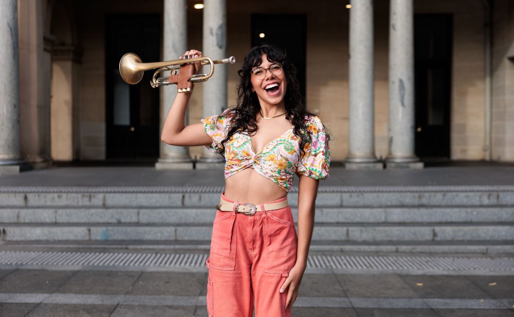 woman with a trumpet outside Customs House Sydney