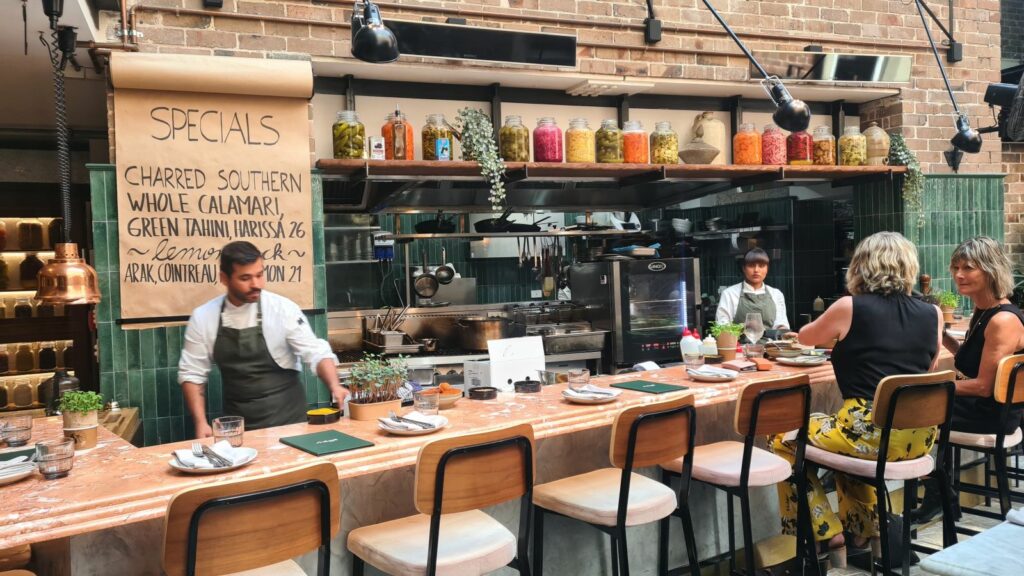 Chefs cooking at the Shaffa counter brunch