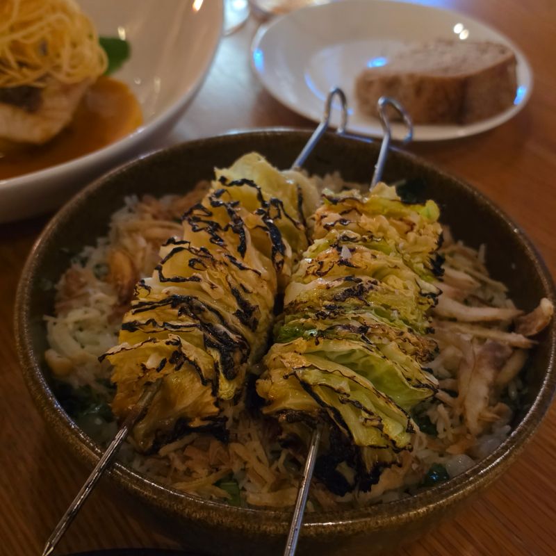 Roasted savoy cabbage with shio koji marinade, macadamia and rice pilaf at Atelier by Sofitel restaurant