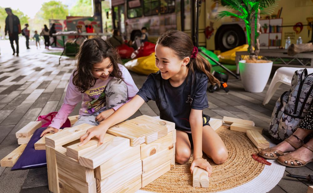 Kids playing with wooden toys in Darling Harbour