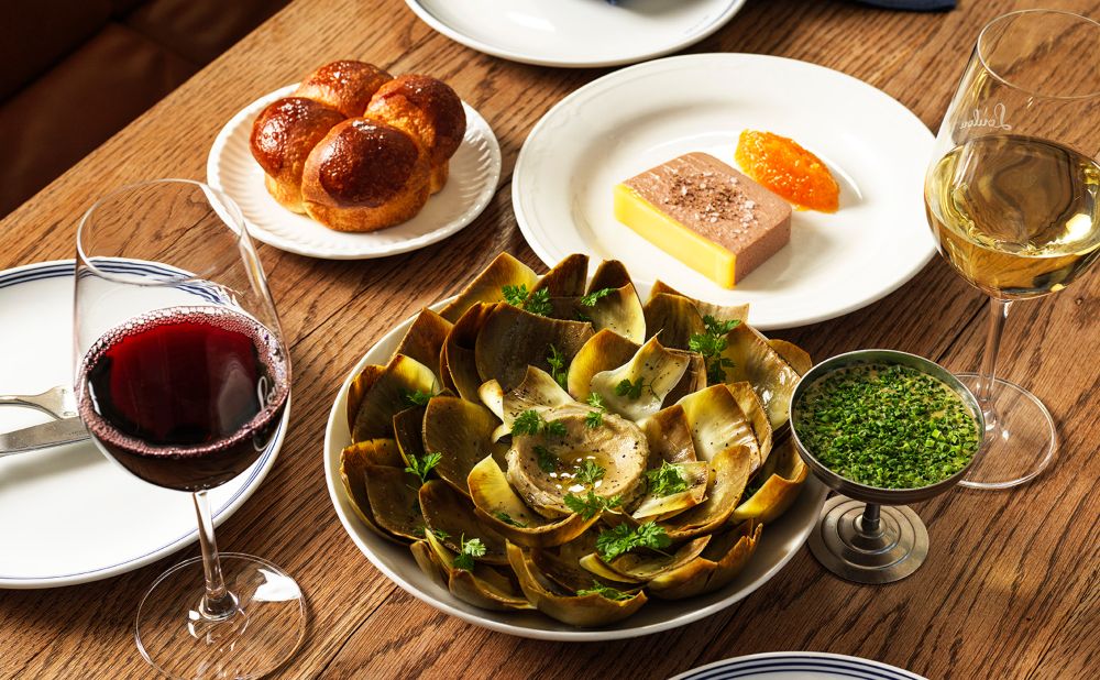 Two glasses of wine with bread, cheese and artichoke from Bistro Lulu