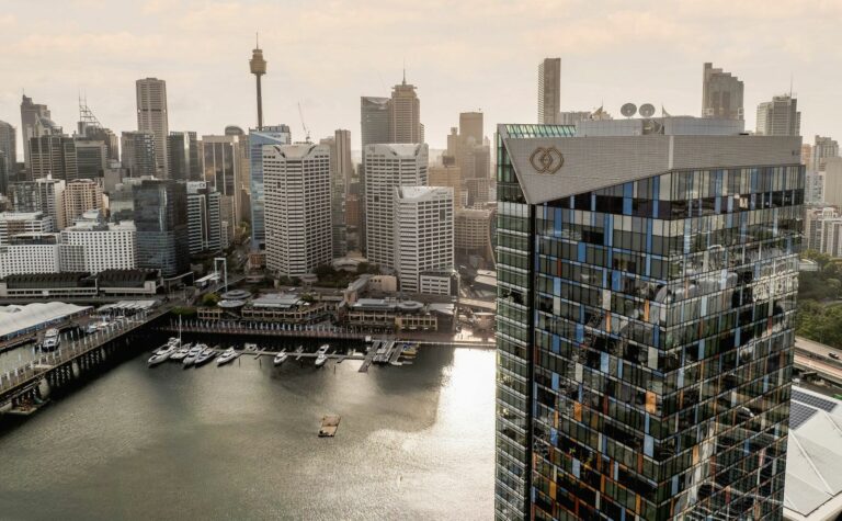 sofitel hotel with the city in the background taken with a drone