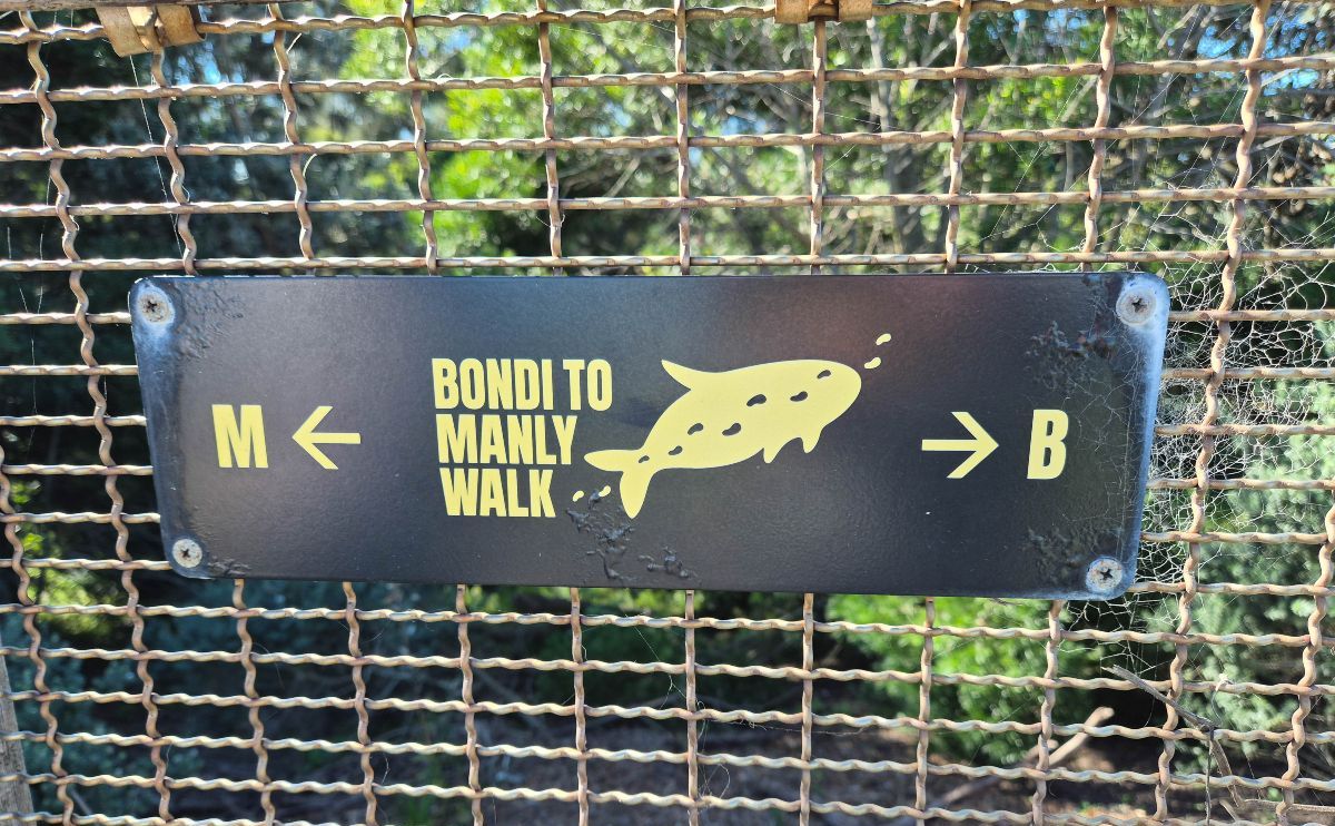 Manly to Bondi Walk sign featuring a yellow whale