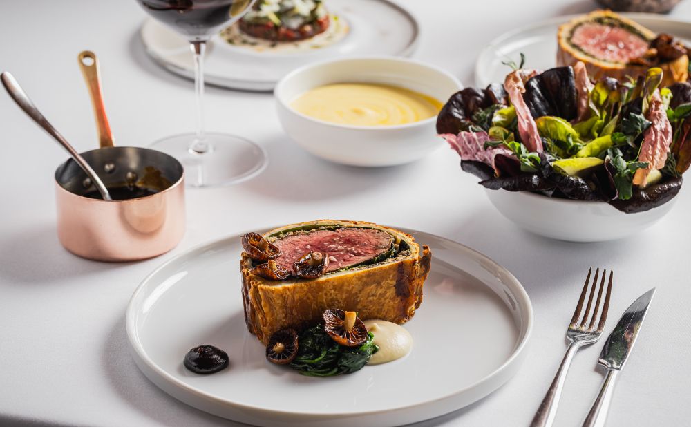 Beef Wellington and sides at Aria Restaurant Sydney