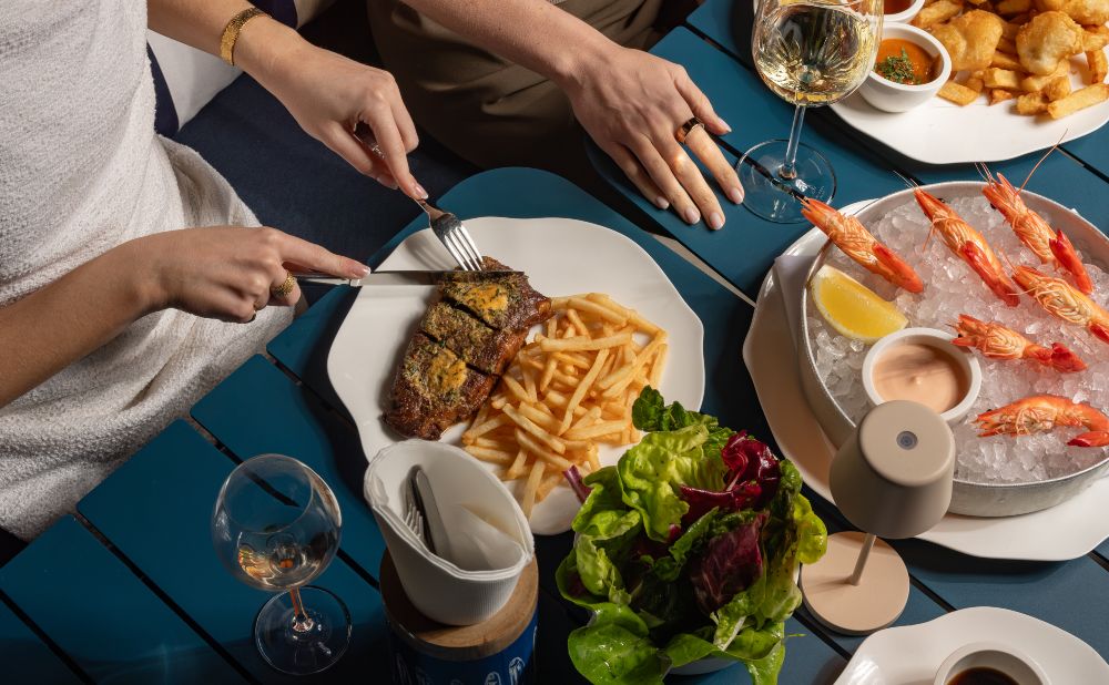 steak and chips, prawns, and salad greens at The Terrace Coogee